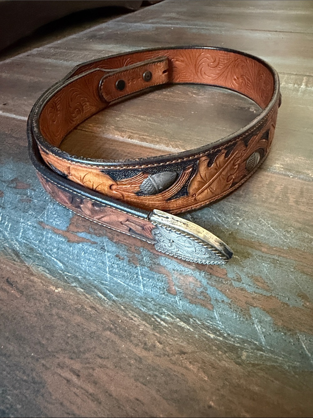 Hand-Tooled Brown Leather Women’s Belt with Silver Acorn accents and silver tip.